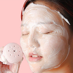 Silicone face scrubber in cute octopus shape, ideal for facial cleansing.